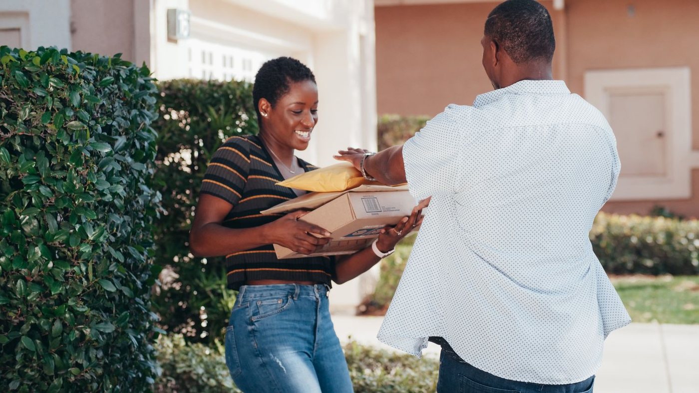 Customer receiving a parcel at their door