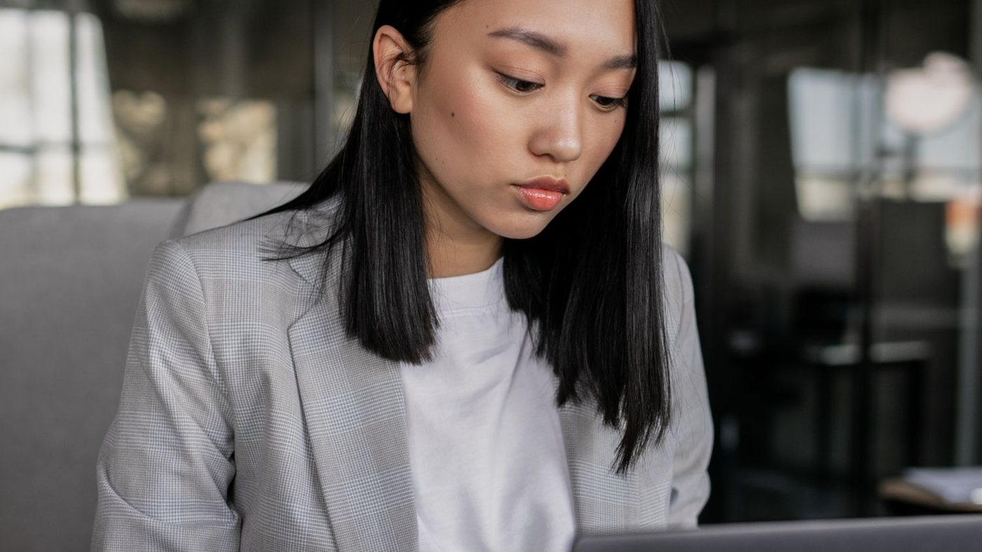 Store owner configuring settings on a laptop